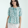 blouses à pois lilas avec manches bouffantes patte boutonnage coupe classique