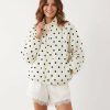 vestes à pois boule oversize motif et survêtement ourlet blanc à pois noirs col montant fermeture éclair