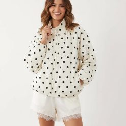 vestes à pois boule oversize motif et survêtement ourlet blanc à pois noirs col montant fermeture éclair