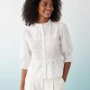 blouses à pois froncée blanc pour femme style chic avec manches bouffantes col volanté et buste smocké