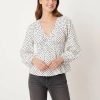 blouses à pois ballon manches mode femme chic élégant blanche avec col en v et taille smockée