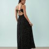 robes noires à pois blancs en tulle sans manches mi-longue col rond coupe evasee avec doublure noire