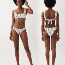 brassières à pois avec bikini blanc maillot de bain femme deux pièces imprimé à pois noirs avec un anneau doré au centre du haut de maillot