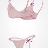 strings à pois floqués rose lingerie femme sexy ensemble comprenant un soutien gorge en dentelle rose et son string assorti décoré de noeuds rose foncé