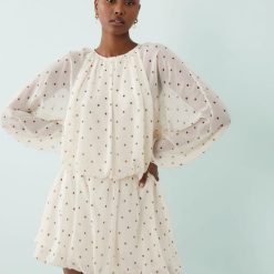 robes mousseline à pois courte en noir et blanc fluide à manches longues bouffantes col rond et jupe bouffante
