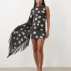 robes noires à petit pois manches courte détail franges imprimés robe courte asymétrique imprimé pois crème et franges élégante