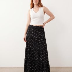 jupes longues à pois et volants étagés femme- jupe longue noire fluide imprimée de petits pois blancs avec volants superposés