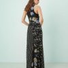 robes à pois années 50 godets longue encolure nageur biais fleurs motif noire imprimé floral et pois vue de dos