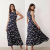 robes a pois bleu marine longue godets dos nageur jupe sans manches evasee avec imprime pois creme vue de face et de dos