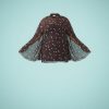 robes longues marron à pois col montant manches cape drapée en voile transparent et coupe fluide sur fond bleu clair