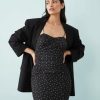 robes en tulle à pois buste contrastant sur ourlet sirène empiècement moulante noire à bretelles portée avec un blazer noir