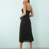 robes longues noires à pois fines bretelles fente cuisse fluide en voile noir avec dentelle au decollete