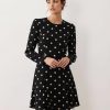robes évasées à pois noirs courte découpe dos ourlet avec manches longues et pois blancs élégants idéal pour un look chic