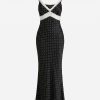 robes longues noires à pois dentelle bretelles fines satin contrastantes moulante avec encolure en v et dentelle blanche sous la poitrine