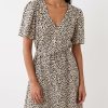 robes longues noires à pois coquillage taille nouée courte beige imprimé taches noires col v manches courtes boutons