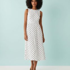 robes à pois jaune petite babydoll sans manches blanc mi longue pour femme col rond avec motifs noirs