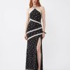 robes évasées à pois longue tulle dentelle nu dos finitions contrastantes noire avec fente sur la jambe et col halter