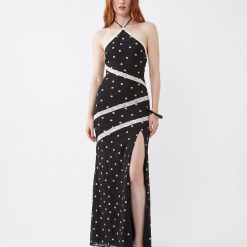 robes évasées à pois longue tulle dentelle nu dos finitions contrastantes noire avec fente sur la jambe et col halter
