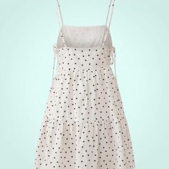 robes à pois transparentes courte de plage blanc a bretelles fines ajustables et coupe evasee a volants